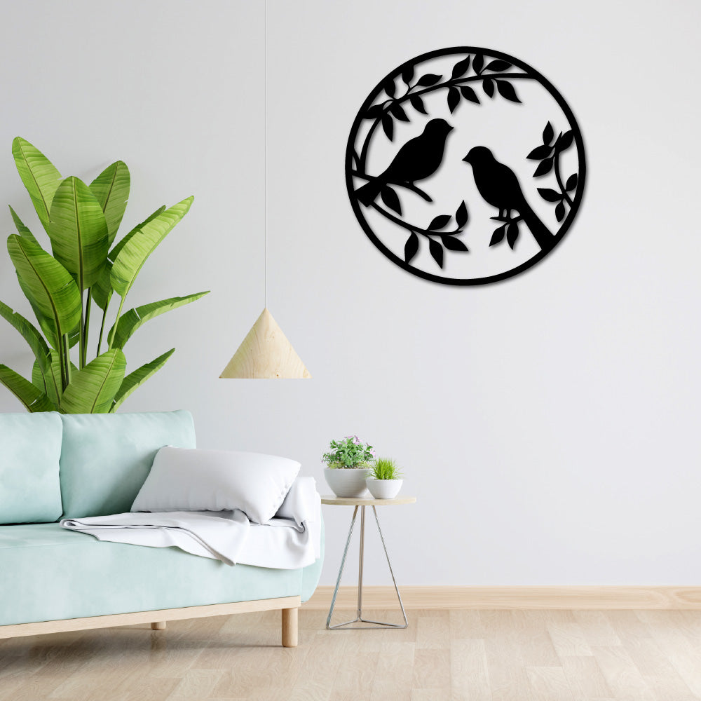 Lovers' Perch wall art displayed in a modern living room with green plants and minimalist decor