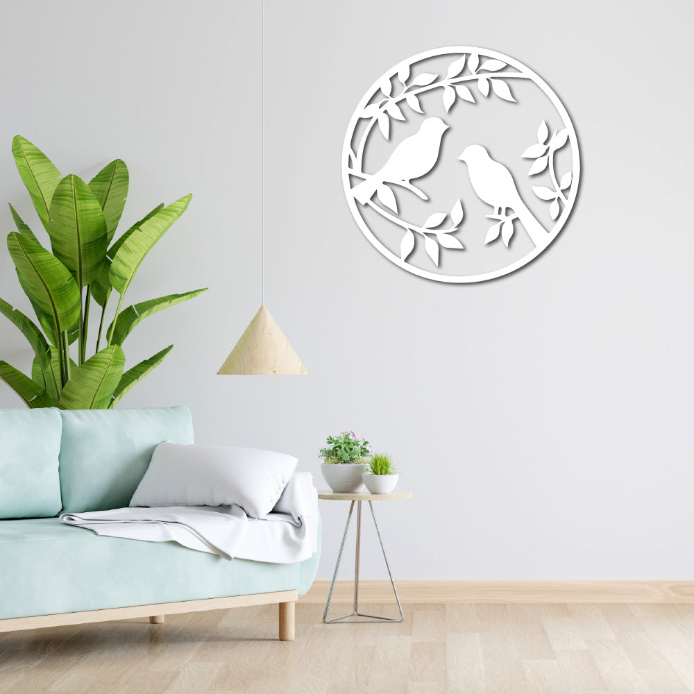 Lovers' Perch wall art displayed in a modern living room with green plants and minimalist decor