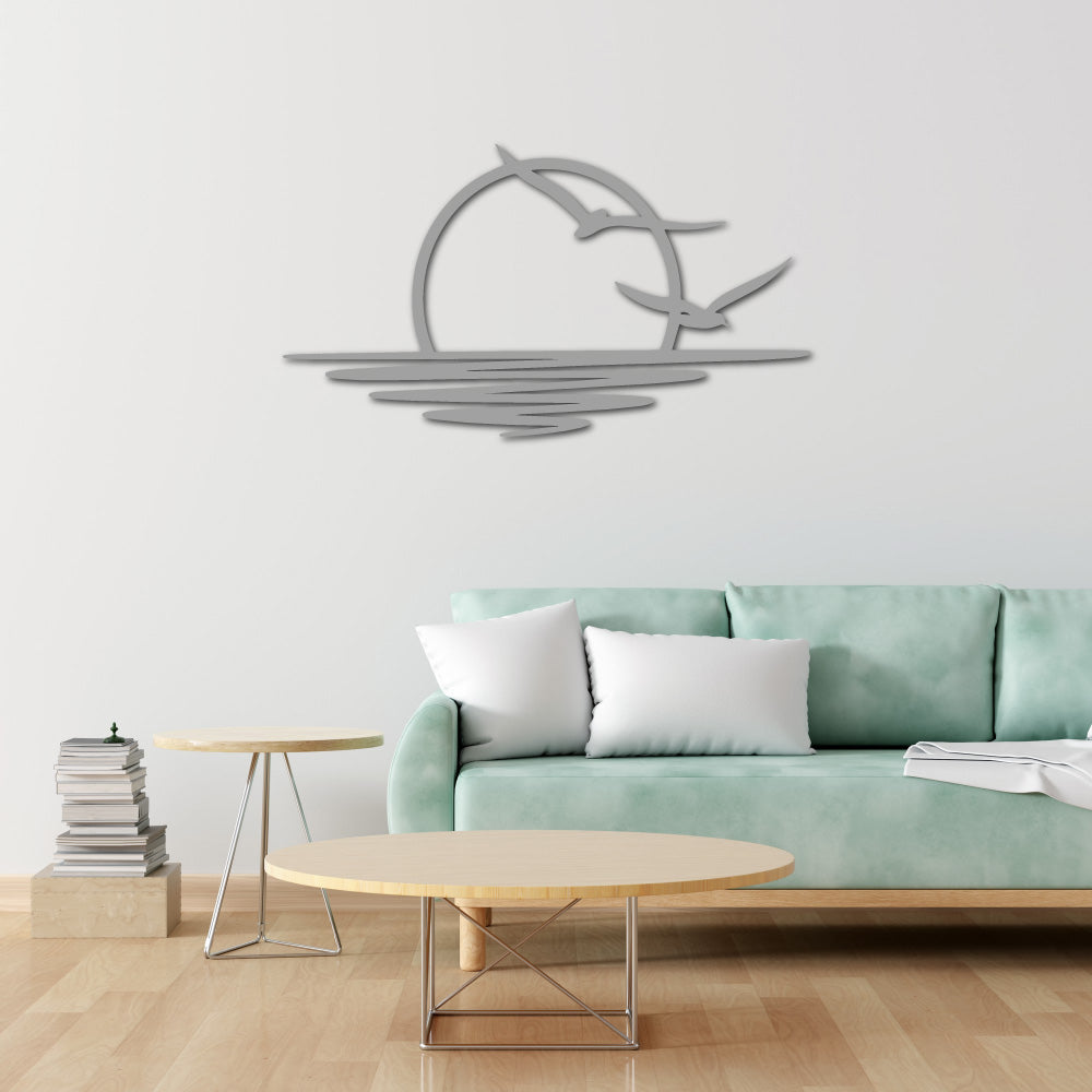 Steel wall art silhouette of a sunset with birds flying over water, a minimalist and elegant design for modern home decor.