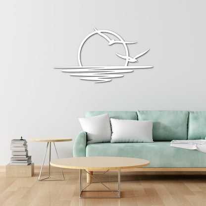 Steel wall art silhouette of a sunset with birds flying over water, a minimalist and elegant design for modern home decor.